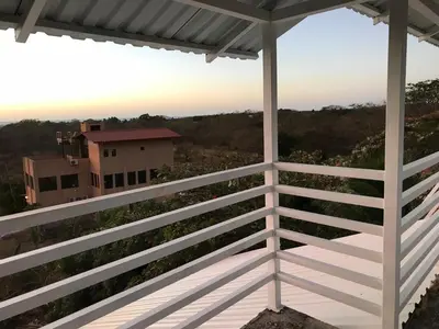 a view from the balcony of a house at Coco Loco Azul Boutique Apartments by Lucky Vacation Homes in Playa Junquillal
