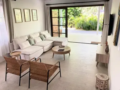 a living room with a white couch and a table at New house in Playa Hermosa in Playa Hermosa