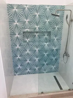 a shower with a blue and white tile wall at New house in Playa Hermosa in Playa Hermosa