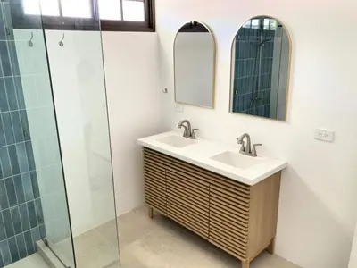 a bathroom with a sink and a glass shower at New house in Playa Hermosa in Playa Hermosa