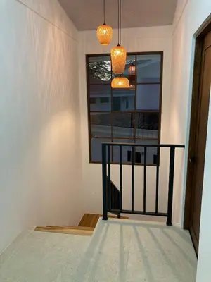 a room with a balcony with a window and two lights at New house in Playa Hermosa in Playa Hermosa