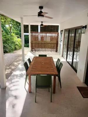 a dining room with a wooden table and chairs at New house in Playa Hermosa in Playa Hermosa