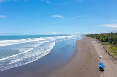 an overhead view of a beach with people and the ocean at Casa Brisa y Mar - Poolside Bliss, Walk to Beach in Bejuco