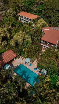 an aerial view of a resort with a swimming pool at Villa Del Sol Boutique Hotel in Coco