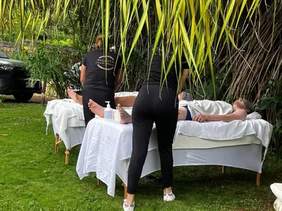 a woman standing on top of two beds at Villa Del Sol Boutique Hotel in Coco