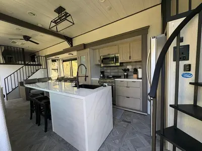 a kitchen with a large white island in a house at Villa Sura in Colón