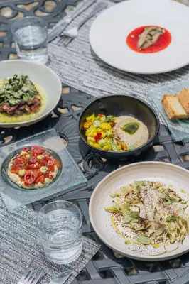 a table with plates of food on top of it at Cedrela Eco-Lodge & Restaurante in El Copey