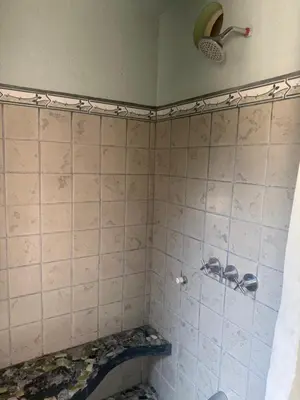 a bathroom with a tiled shower with at LaCusuca in Guadalajara