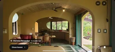 an archway in a room with a kitchen and a table at LaCusuca in Guadalajara