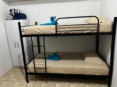 a couple of bunk beds in a room at El Bosque Apartments in Sámara