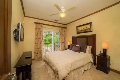 a bedroom with a bed and a ceiling fan at Veranda 1B - 3 bdr 3 bath in La Mona