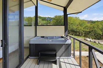 a bathroom with a tub on a deck at Casas Oria Monteverde in Monteverde Costa Rica