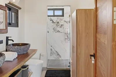 a bathroom with a sink and a shower at Casas Oria Monteverde in Monteverde Costa Rica