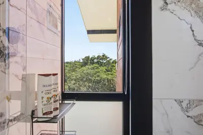 a door with a window in a room at Casas Oria Monteverde in Monteverde Costa Rica