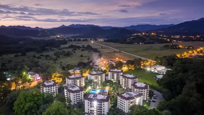 an aerial view of a city at night at COSTA LINDA Charming 1-03 in Jacó