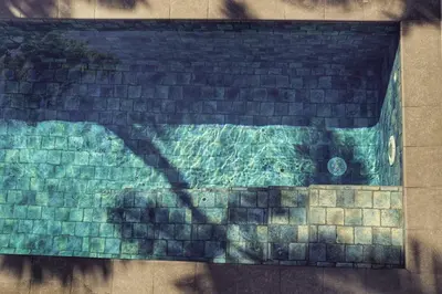 a shadow of a person on a brick wall at Casa Kimara in Uvita