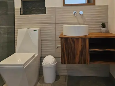 a bathroom with a sink and a toilet at Mystica in Playa Avellana