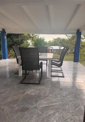 a table and chairs sitting on a patio at Tivives Kikala Lodge 2 in Puntarenas