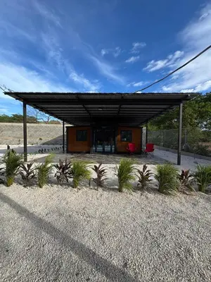 a building in the middle of a desert with plants at Casa Bolsero - private, small home in Tamarindo in Tamarindo
