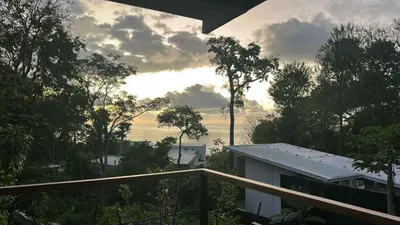 a view from the balcony of a house at Casa Joy - 3 Apartment Villa in the Hills of Santa Teresa in Santa Teresa Beach