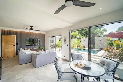 a living room with a table and chairs at Casa Vineta, Apartment in Duplex, close to beach in Carrillo