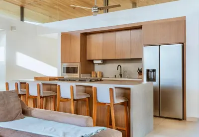 a kitchen with a large island with a counter top at Nimbu Vida in Tamarindo