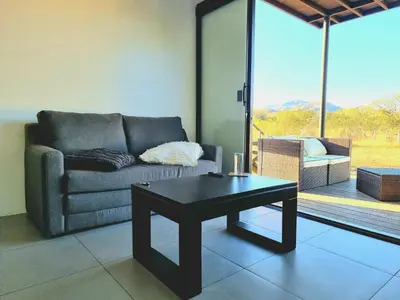 a living room with a couch and a coffee table at Playa Potrero in Potrero