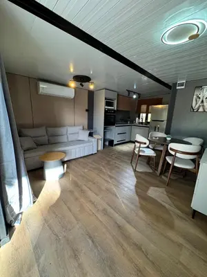 a living room with a couch and a table at Casa Mosquero - lovely 1 bedroom home in Tamarindo - private and serene in Tamarindo