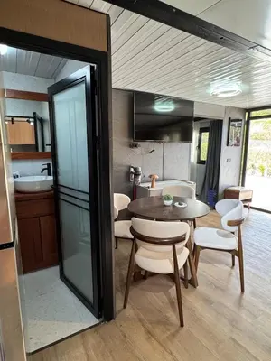 a kitchen and dining room with a table and chairs at Casa Mosquero - lovely 1 bedroom home in Tamarindo - private and serene in Tamarindo
