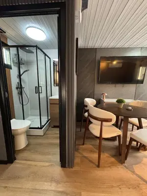 a room with a table and chairs and a bathroom at Casa Mosquero - lovely 1 bedroom home in Tamarindo - private and serene in Tamarindo