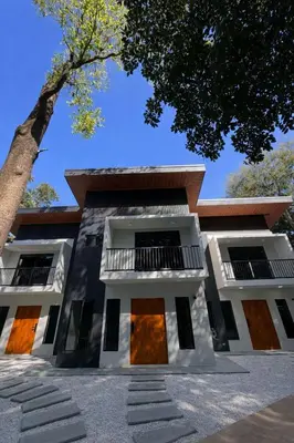 a building with a tree in front of it at Blue Zone Private Eco Residence - Essence Suite - in Tamarindo