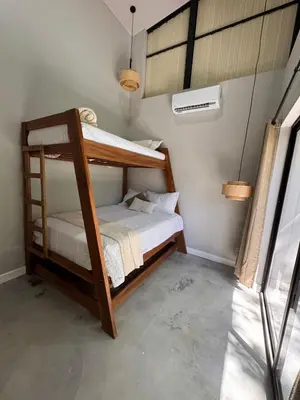 a bedroom with two bunk beds in a room at Blue Zone Private Eco Residence - Essence Suite - in Tamarindo