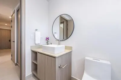 a bathroom with a sink and a mirror at Brisa Mar, Ocean Views, Beach Club & Pools in Sardinal