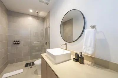 a bathroom with a sink and a mirror at Vista Paz Condo, Ocean Views & Beach Club in Sardinal