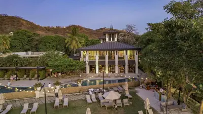 an aerial view of a resort with a pool at Pacific Valley at Naumi, Beach Club, Gym, Pools in Sardinal