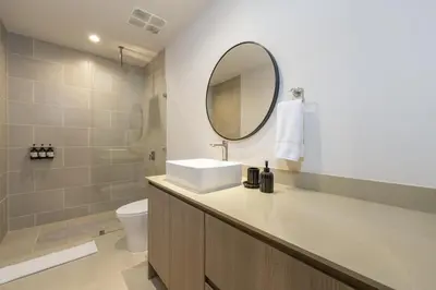 a bathroom with a sink and a mirror at Casa Mint, Ocean Views, Pools, Gym & Beach Club in Sardinal