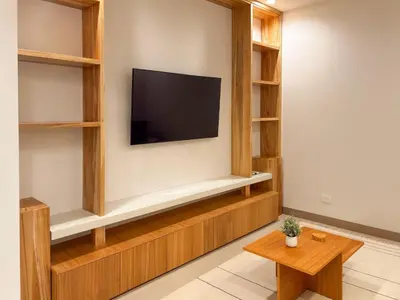 a living room with a tv on a wall at Costa Azul Condo, Ocean View & Beach Club in Sardinal