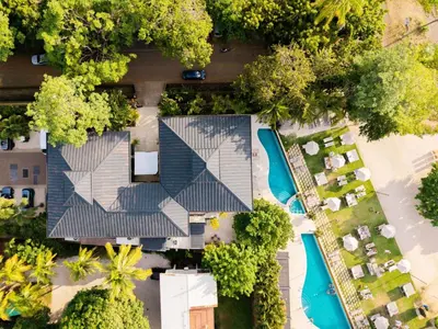 an overhead view of a house with a swimming pool at Costa Azul Condo, Ocean View & Beach Club in Sardinal