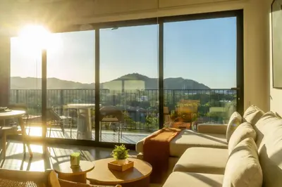 a living room with a large window with a view at Costa Azul Condo, Ocean View & Beach Club in Sardinal