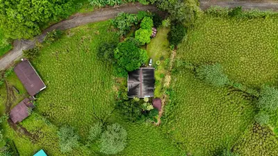 an overhead view of a field with a car in it at Selva Partners La Fortuna in Guaria
