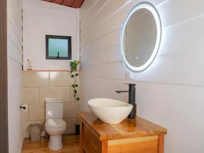 a bathroom with a sink and a toilet at Nido de Montaña in Fraijanes