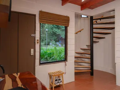 a room with a window and a stair case at Nido de Montaña in Fraijanes