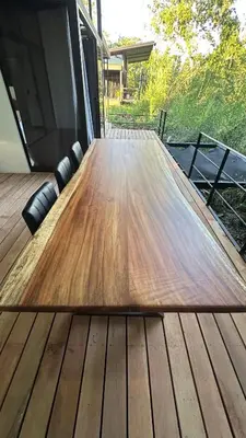 a wooden table sitting on top of a wooden deck at Bamboo grove villa in San Isidro