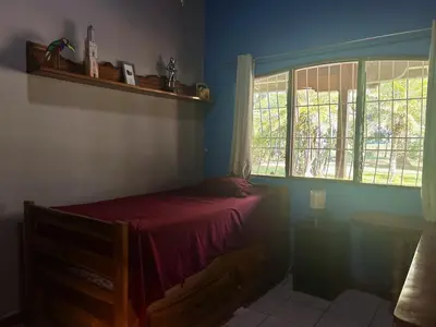 a bedroom with a bed and a window at Cantarrana Countryside Villa with private pool