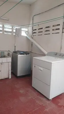 a laundry room with two machines and a washer and dryer at Cantarrana Countryside Villa with private pool