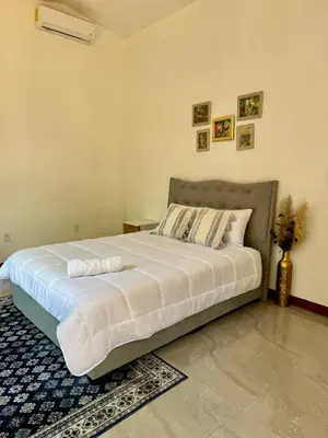 a bedroom with a large bed in a room at Villa Republik in Parrita