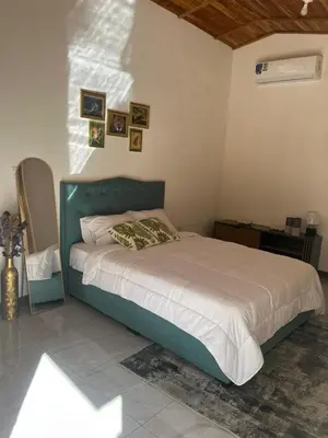 a bedroom with a bed in a room at Villa Republik in Parrita