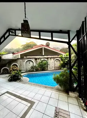 a view of a house with a swimming pool at Punta Leona, Sotavento 1 Plea Mar casita in Punta Leona