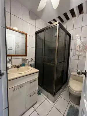 a bathroom with a shower and a sink and a toilet at Punta Leona, Sotavento 1 Plea Mar casita in Punta Leona