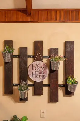 a wall with potted plants and a sign on it at Casa Vegas Panoramic Views near Monteverde in Turín